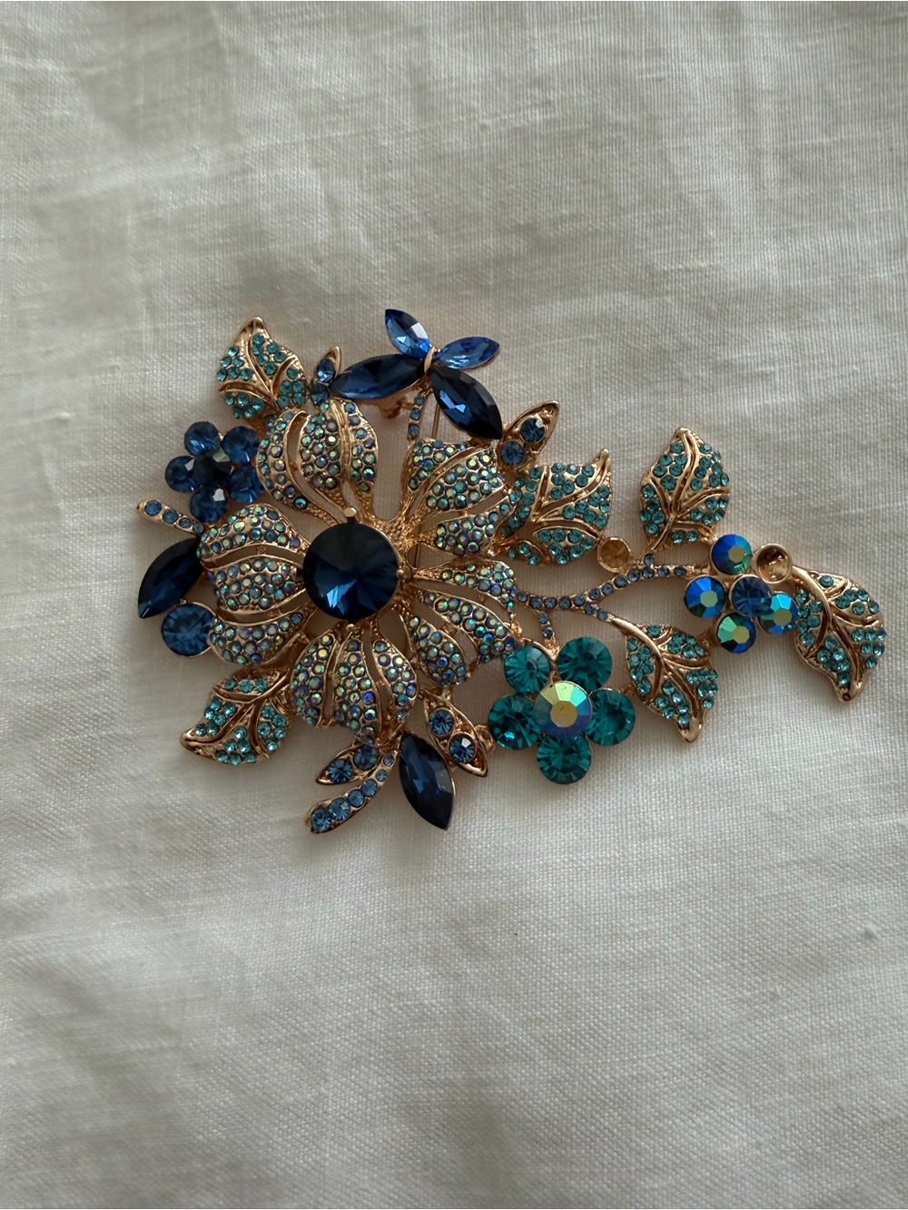 Gold-Tone Floral Crystal Brooch in Blue and Teal